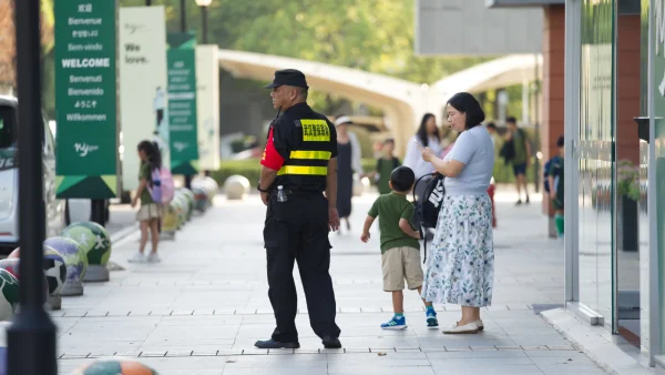 Security guard on campus during dismissal at wuhan yangtze international school.