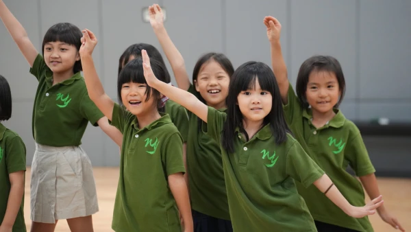 Group of elementary students at the after-school dance club at wuhan yangtze international school.