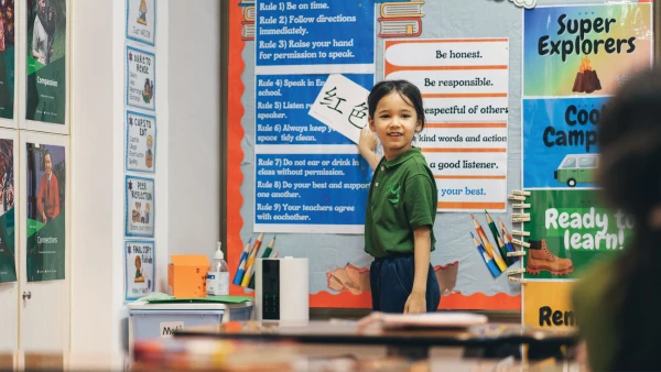 young female student studying chinese in wuhan yangtze international school classroom